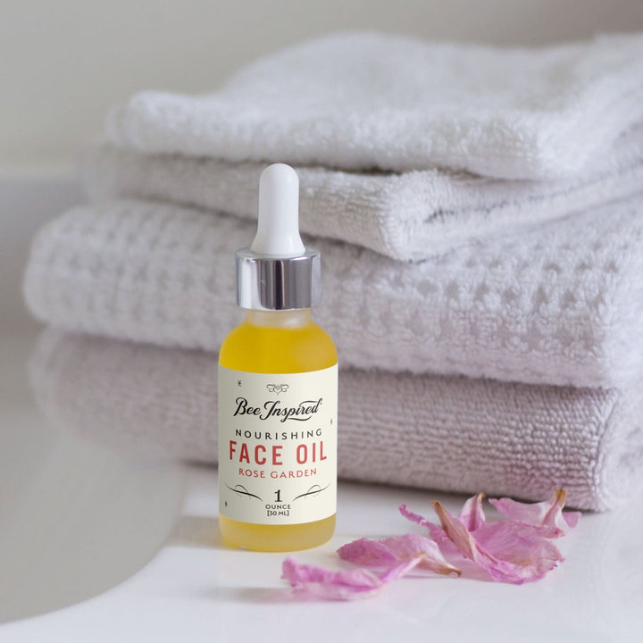 face oil in bathroom setting with towels