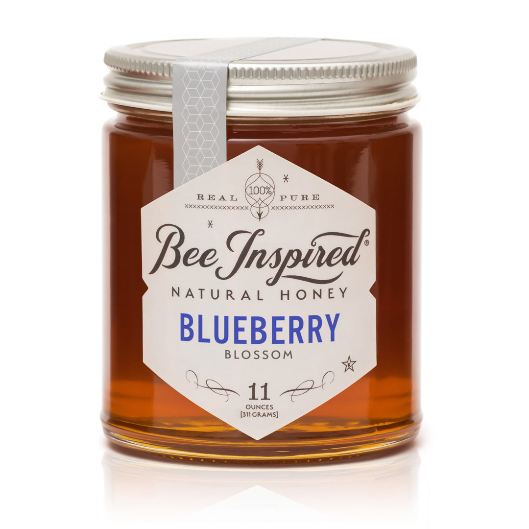 Jar of Bee Inspired Blueberry Blossom honey on a white background