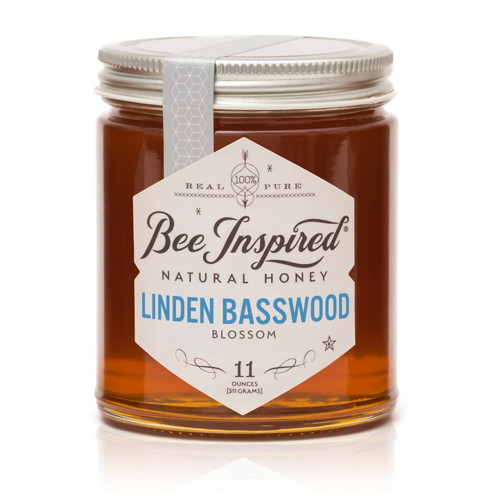 Jar of Bee Inspired Linden Basswood Blossom honey on a white background