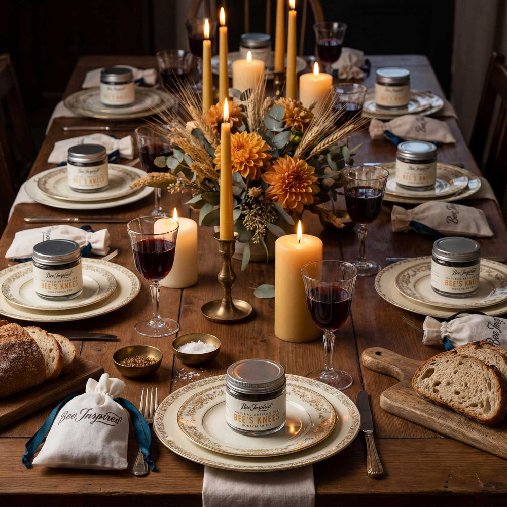 Dining table set for a meal with candles, wine, bread, and decorative items.
