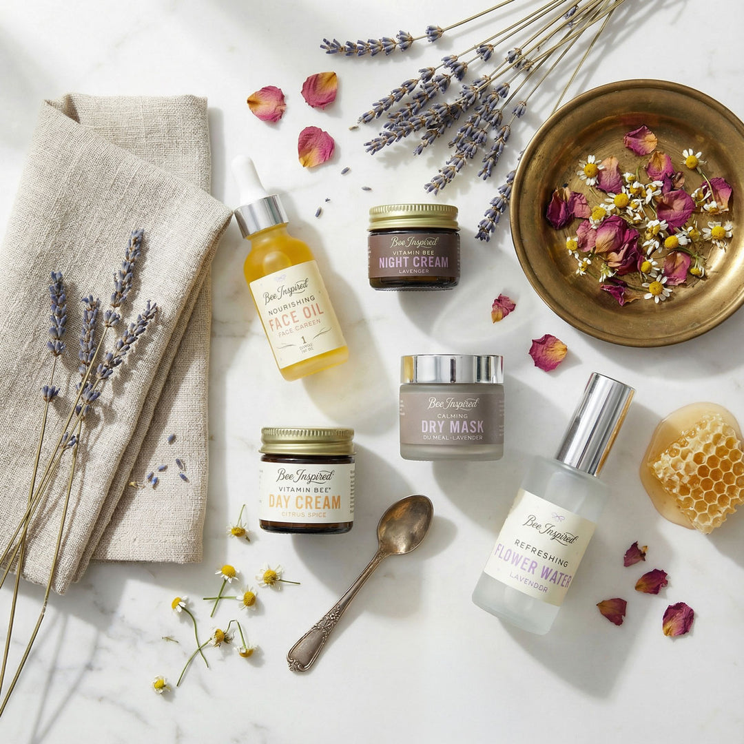 Bee Inspired Best Face Forward skincare products with lavender and flowers on a marble surface

