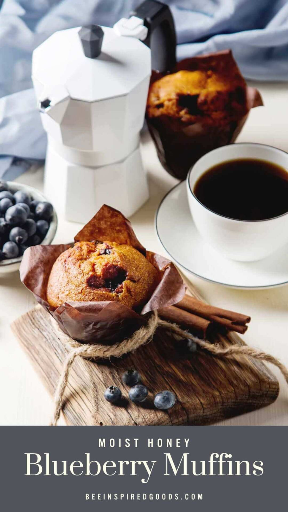 "moist honey blueberry muffins beeinspiredgoods.com" blueberry muffins on a table with raw blueberries