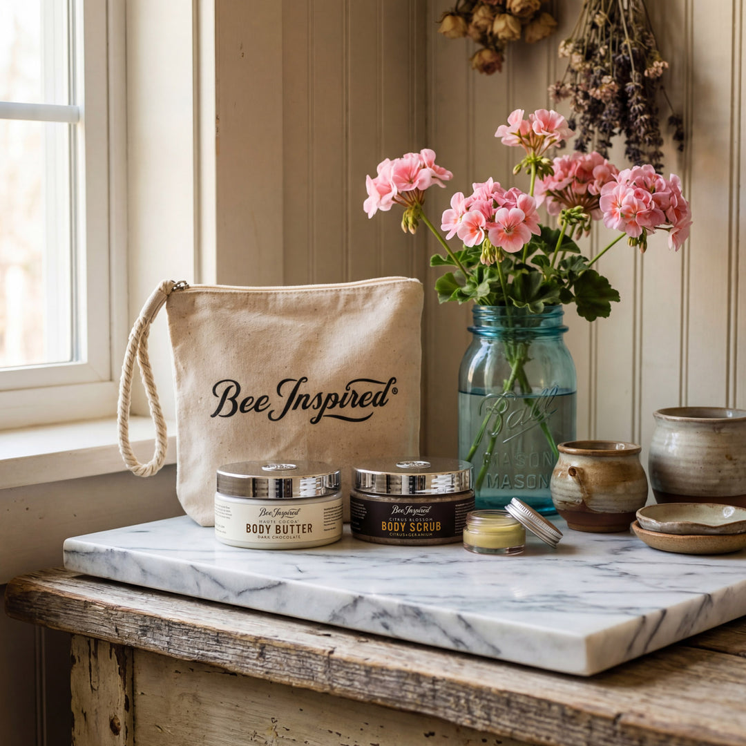 Cosmetic products on a marble surface with 'Bee Inspired' branding, flowers, and rustic decor.