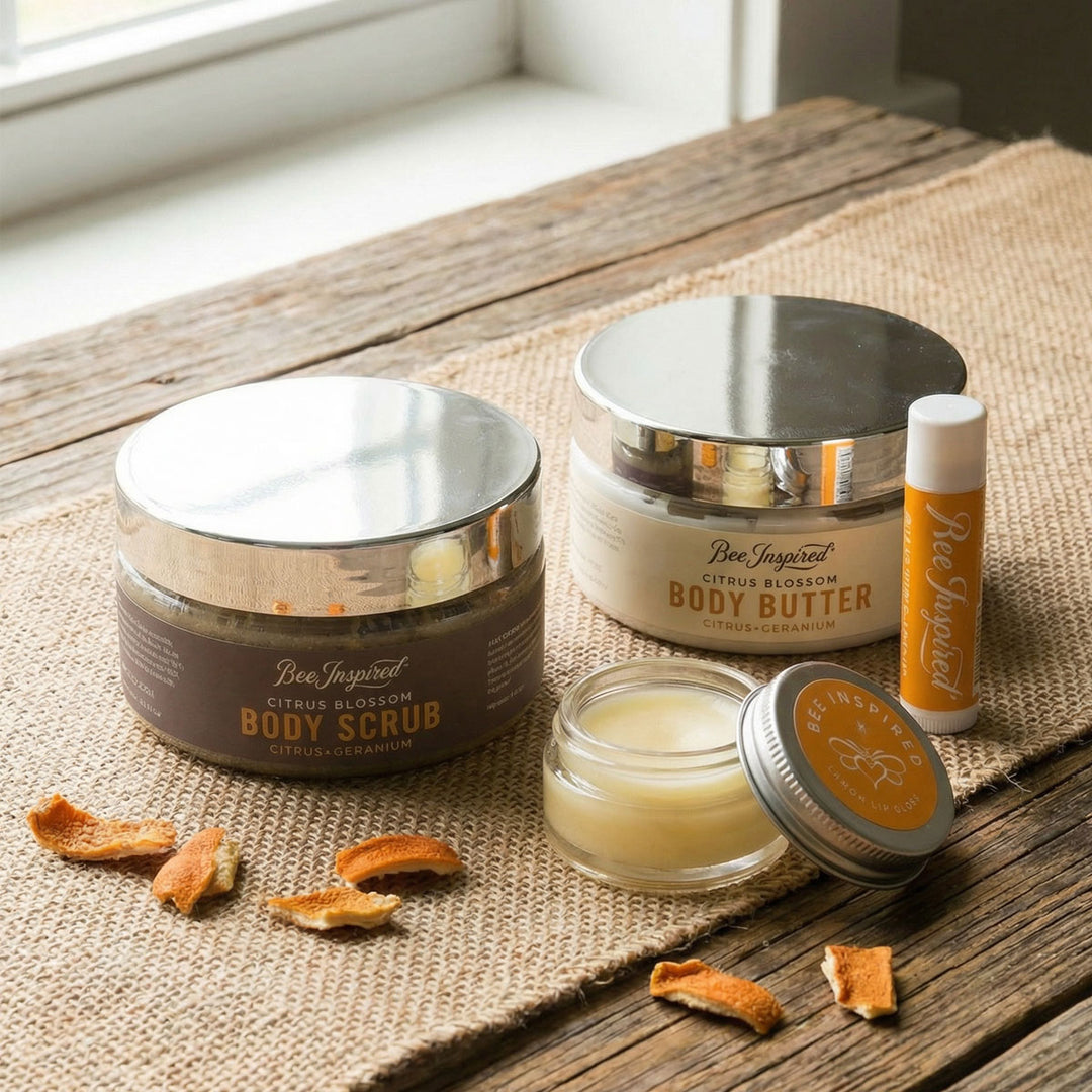 Collection of Bee Inspired body care products on a wooden surface with a natural background.