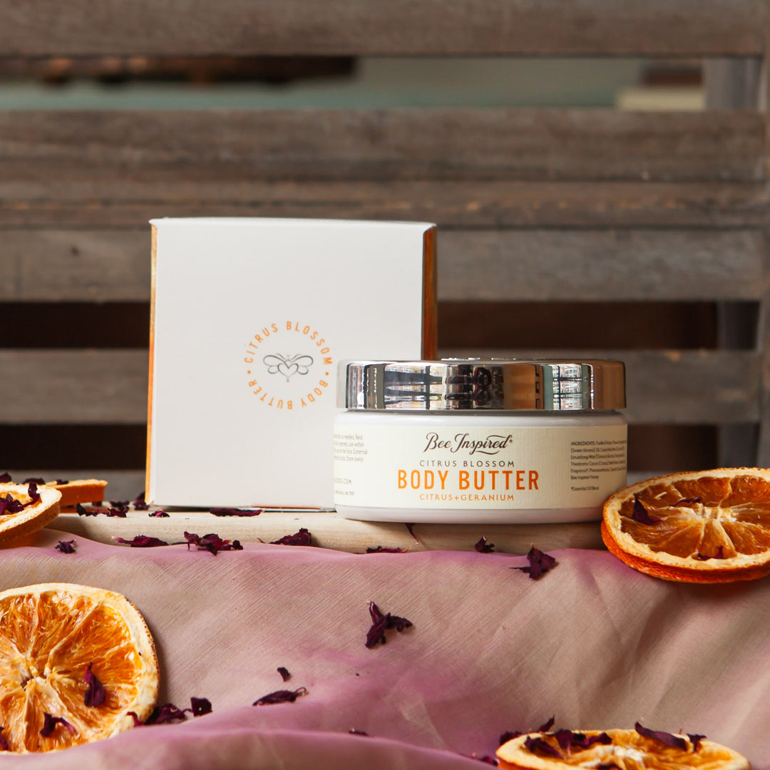 citrus body butter with packaging and ingredients