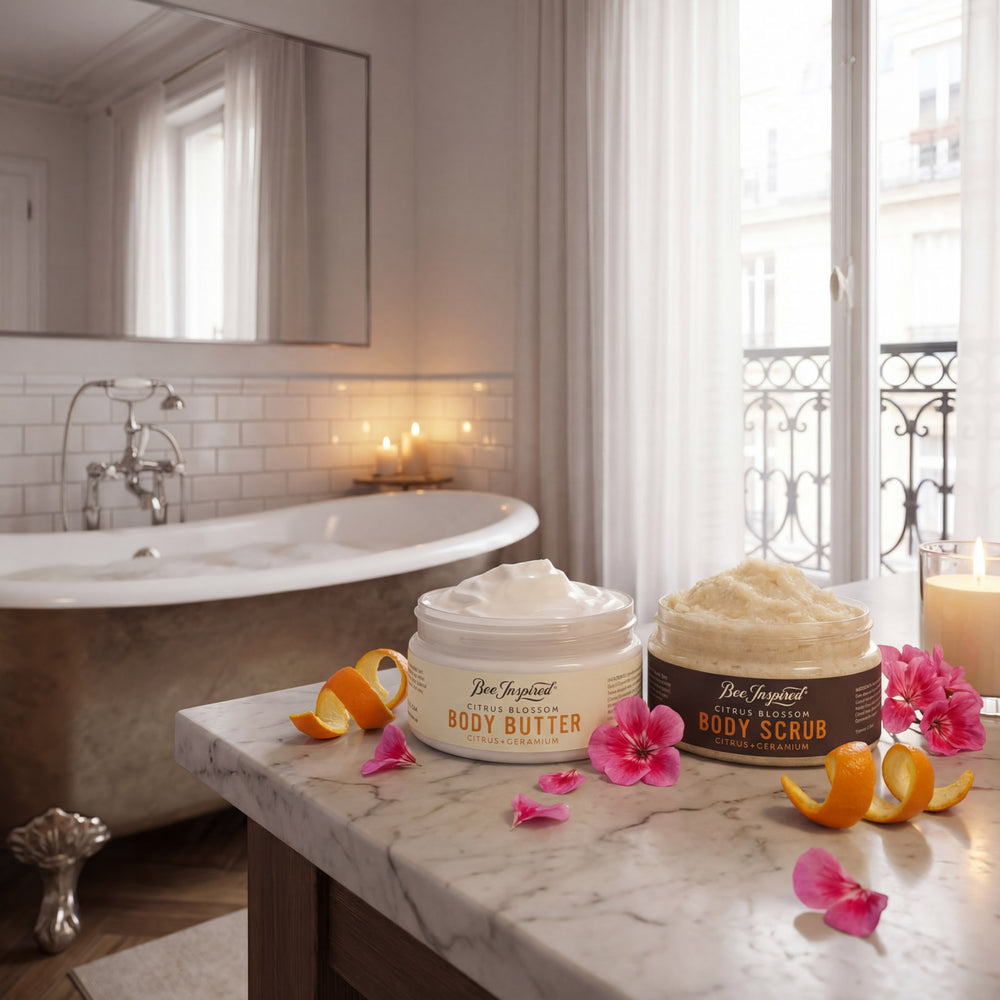 Bath products on a marble counter with a bathroom setting