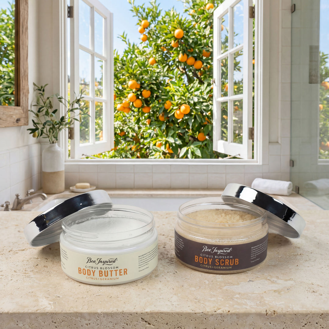 Two jars of body products on a windowsill with an orange tree outside.