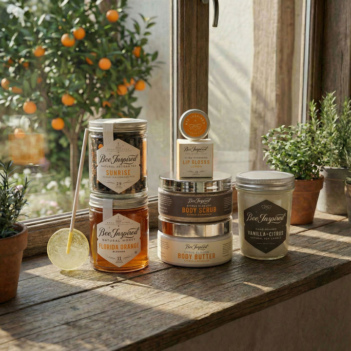 Collection of Bee Inspired products on a wooden surface with a window and plants in the background.