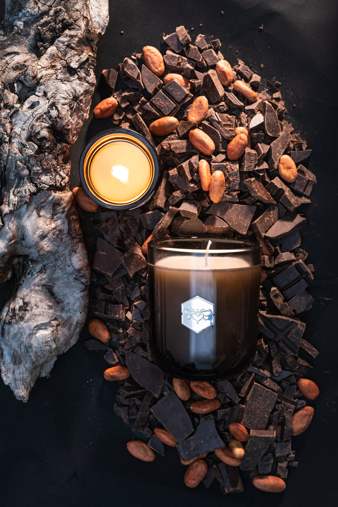 Haute Cocoa luxe candle flat lay with chocolate and almonds 