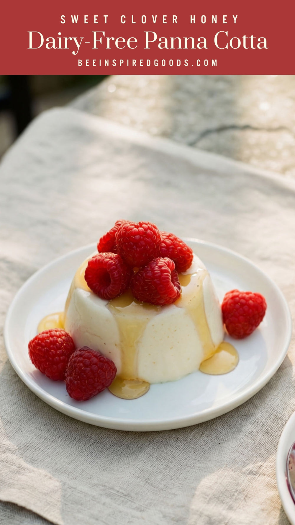 Two plates of dessert with berries and a jar of honey on a stone surface.