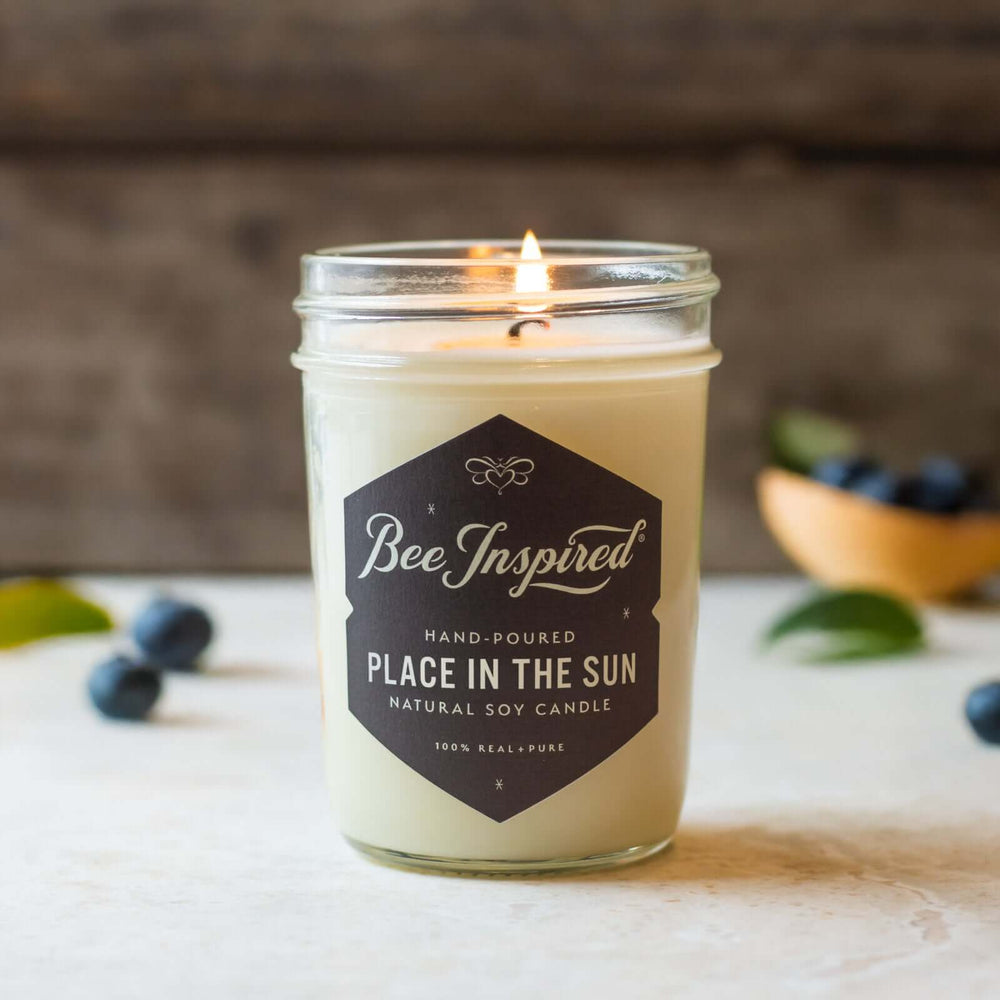 Place in the Sun jelly jar candle with fresh blueberries in the background