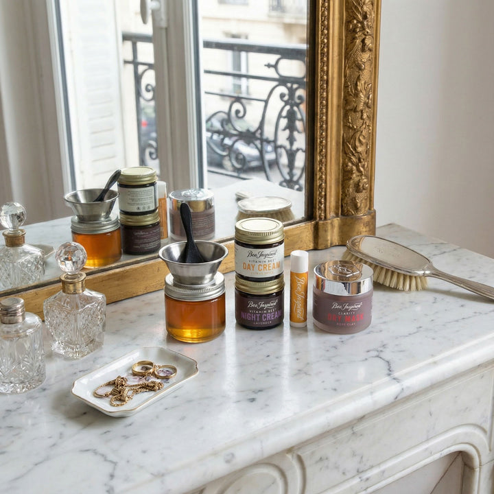 Cosmetic products on a marble surface with a decorative mirror in the background
