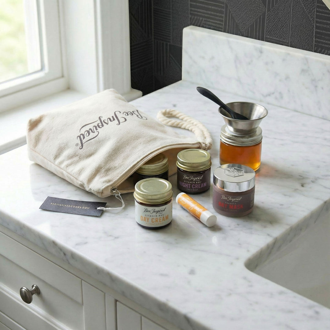 Cosmetic products on a marble countertop with a branded bag.