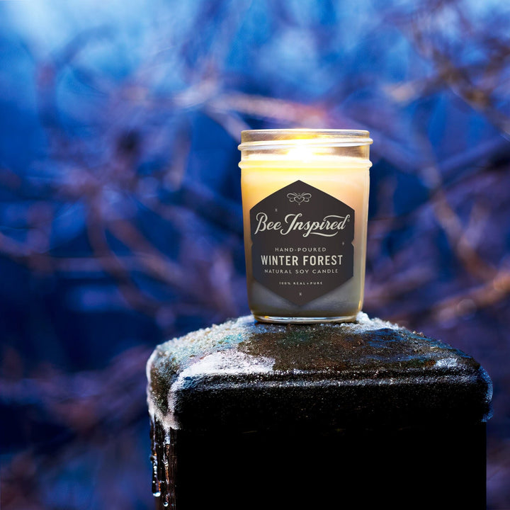 Winter Forest Candle on frozen post at night