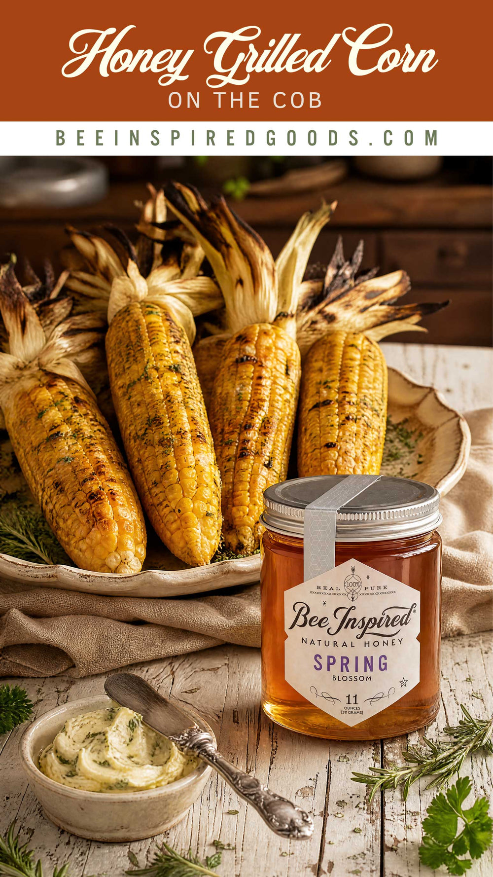 Honey grilled corn on the cob with a jar of Bee Inspired Goods honey on a rustic wooden table.