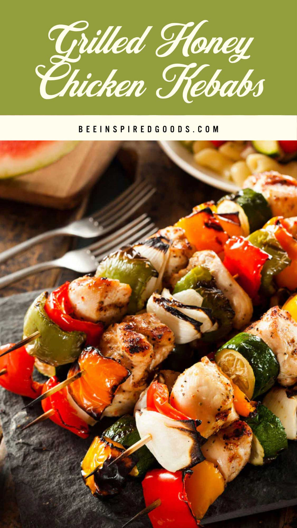 Grilled honey chicken kebabs on a slate board with a green banner and website text.
