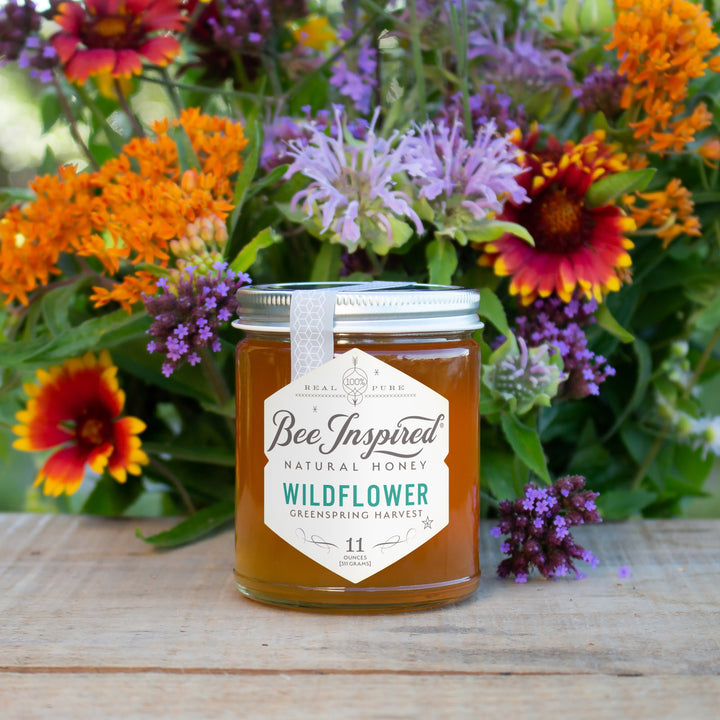 greenspring wildflower honey ifrom bee inspired honey retail store in owings mills in front of flower bouquet