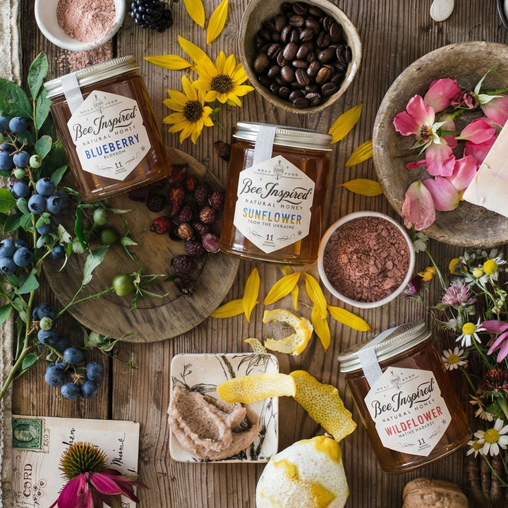 Bee Inspired Honey Explorer's Set with flowers and  berries on a wooden surface.

