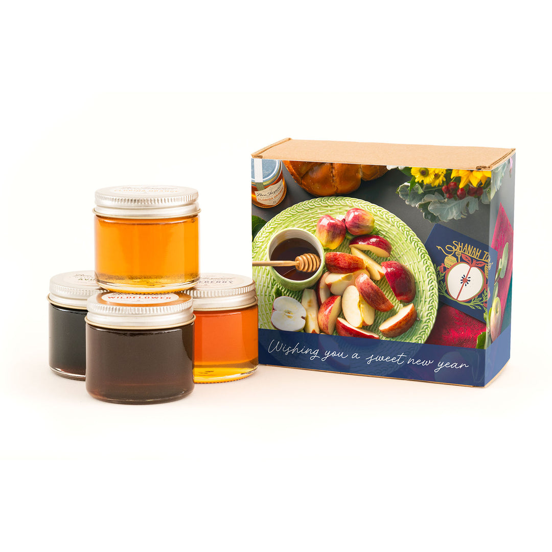 Rosh Hashanah honey gift set against white