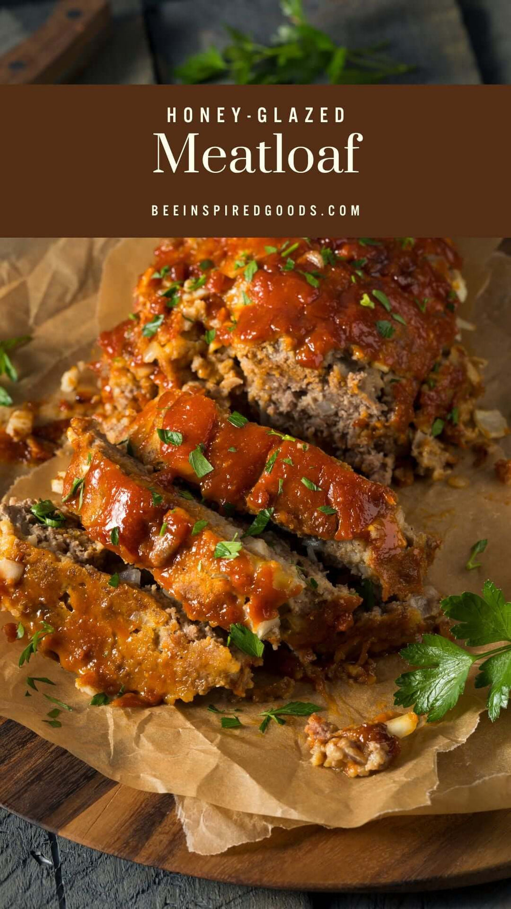 honey-glazed meatloaf slices on parchment paper with the name of the recipe and site