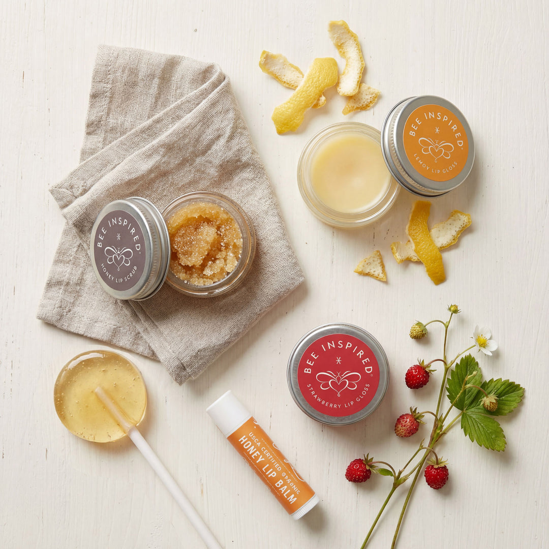 Bee-inspired skincare products on a light surface with natural elements.