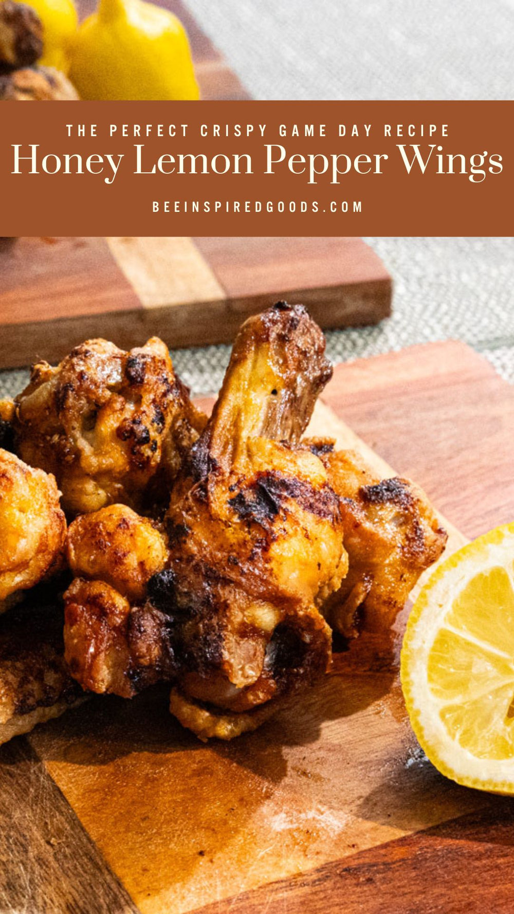 "The Perfect Crispy Game Day Recipe Honey Lemon Pepper Wings beeinspiredgoods.com" with chicken wings on a wooden serving tray