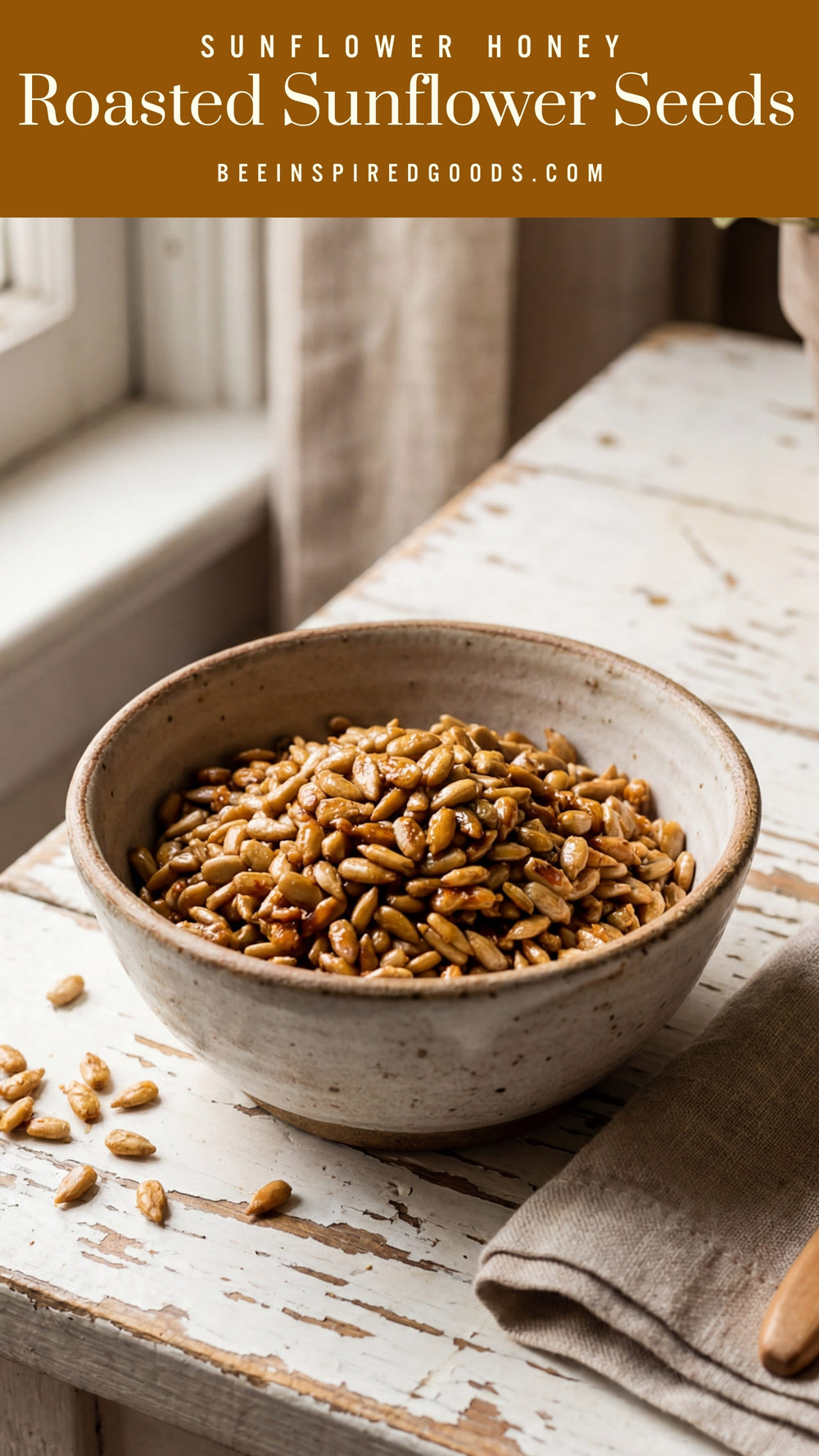 Bowl of roasted sunflower seeds on a wooden table with a beige napkin.
