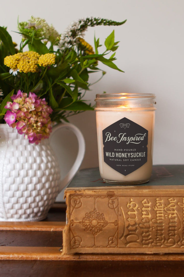 wild honeysuckle soy candle on book