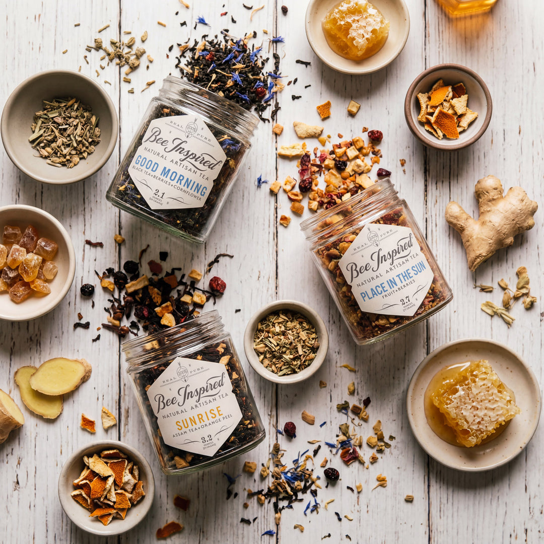 Bee Inspired tea jars with various herbs and spices on a wooden surface