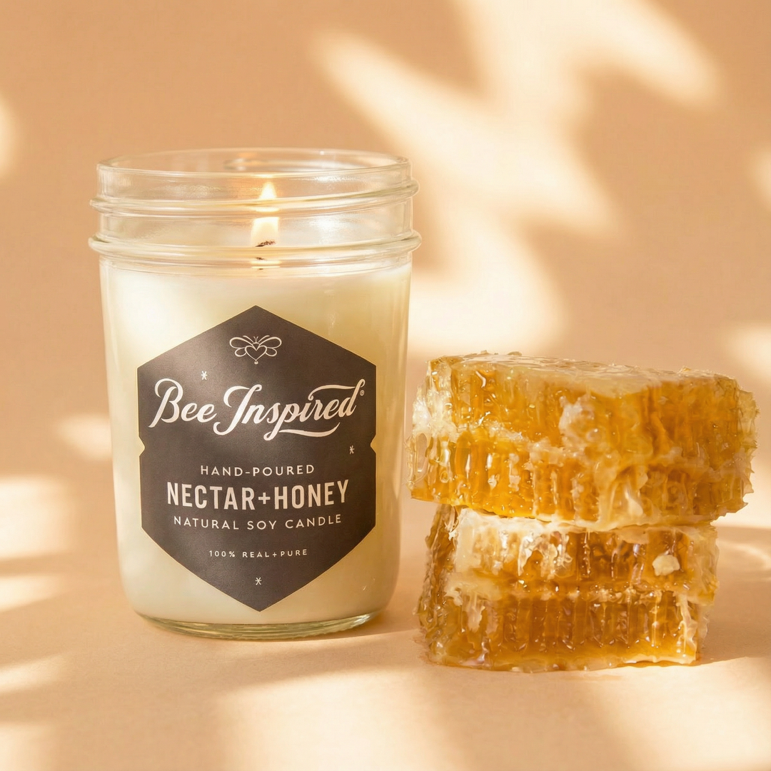 Nectar+Honey candle next to honeycomb on sun dappled set