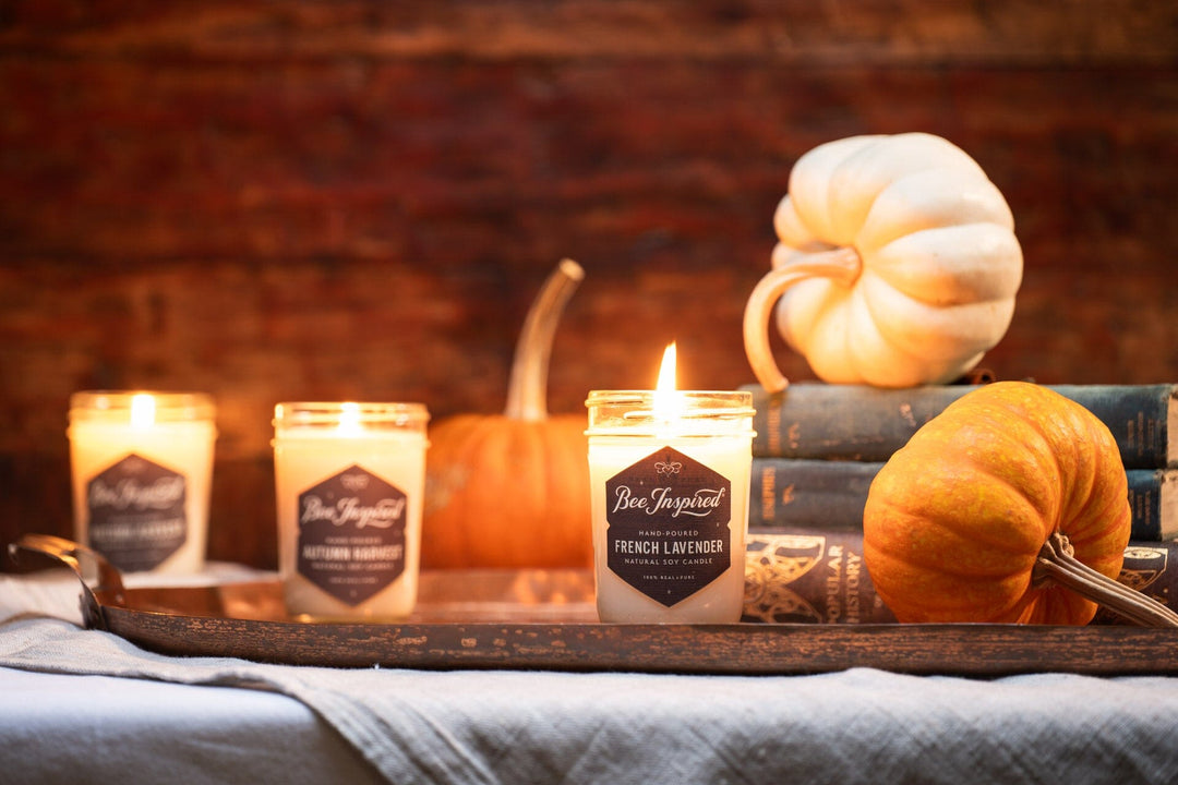 French lavender soy jelly jar candle with pumpkins in library