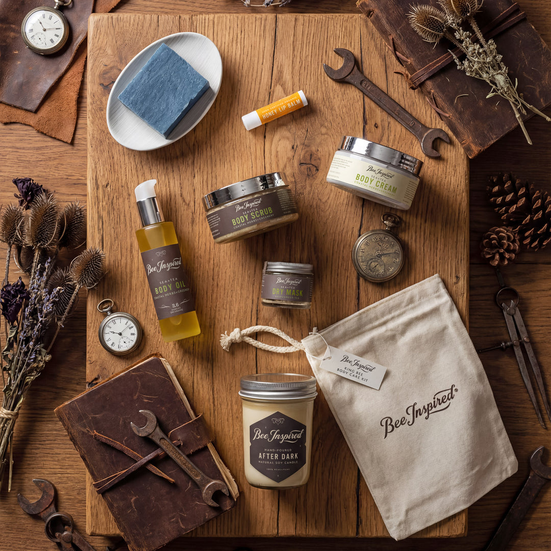 Collection of Bee Inspired products on a wooden surface with tools and natural elements.