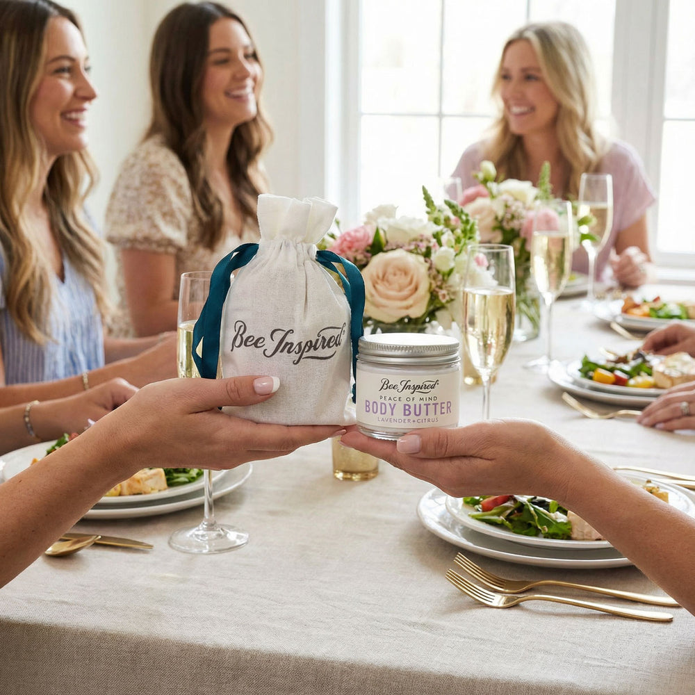 People at a table with Bee Inspired Peace of Mind Body Butter party favors