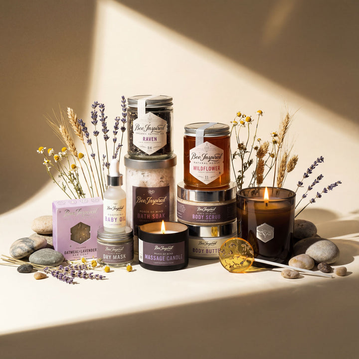 Collection of Bee & Honey products including candles, soaps, and body butters on a neutral background.