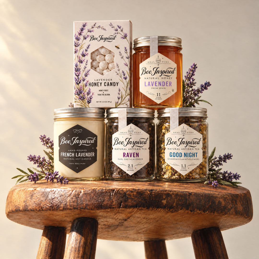 lavender hour gift on set with antique primitive stool, and bee inspired products surrounded by lavender.
