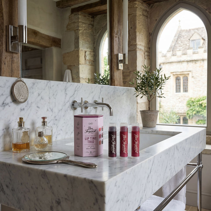 Bathroom counter with skincare products and a window view