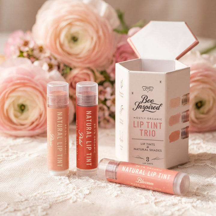 Lip tint trio with packaging on a floral background