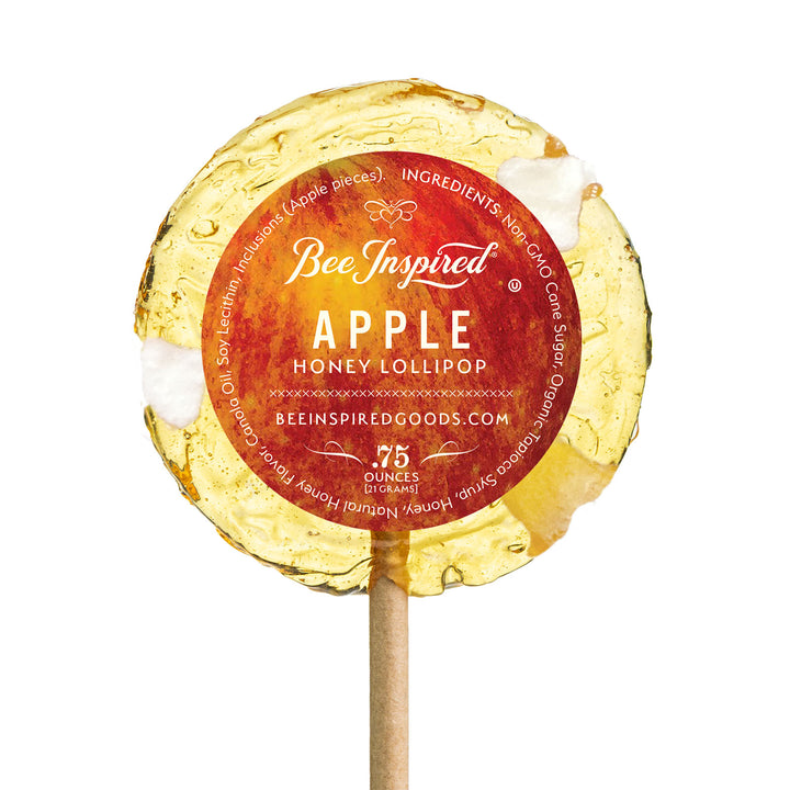 Apple honey lollipop with sticker against white 