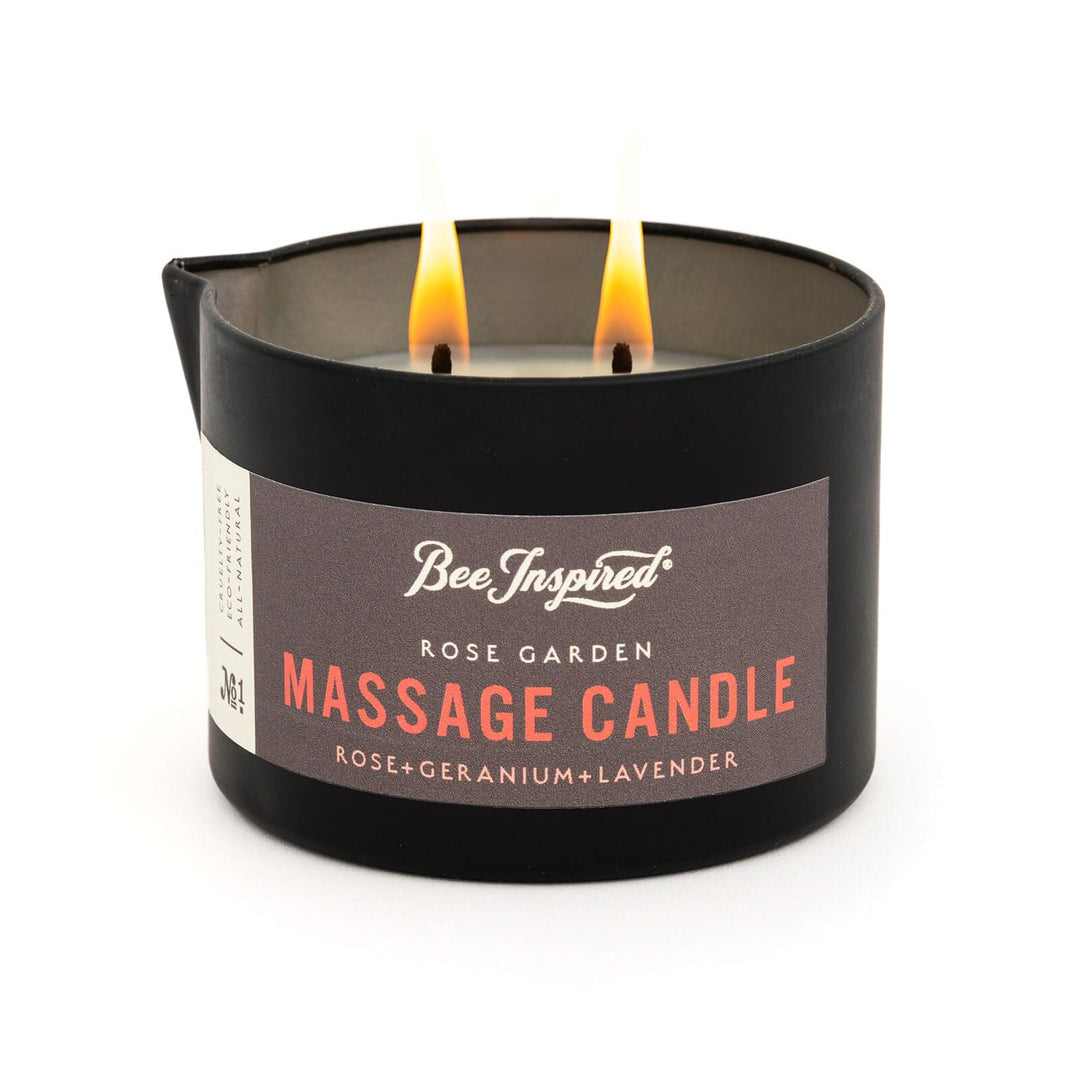 rose garden massage candle with two wicks lit