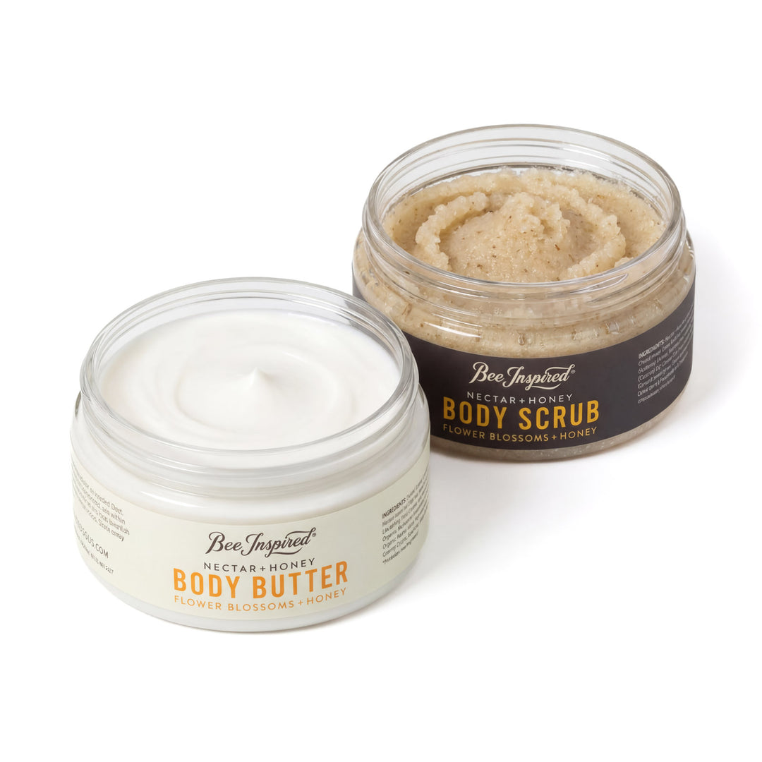 Two jars of 'Bee Inspired' body butter and scrub on a white background