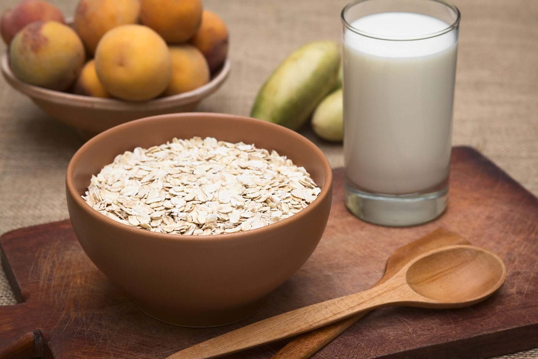 A bowl of oats and a glass of milk 