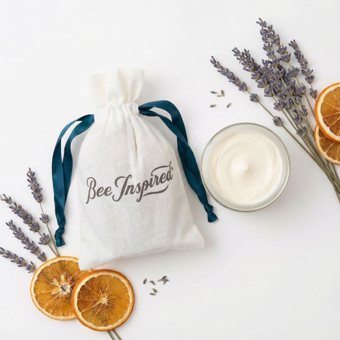 'Bee Inspired' party favor with drawstring bag surounded by dried lavender and dried lemon fruit wheels