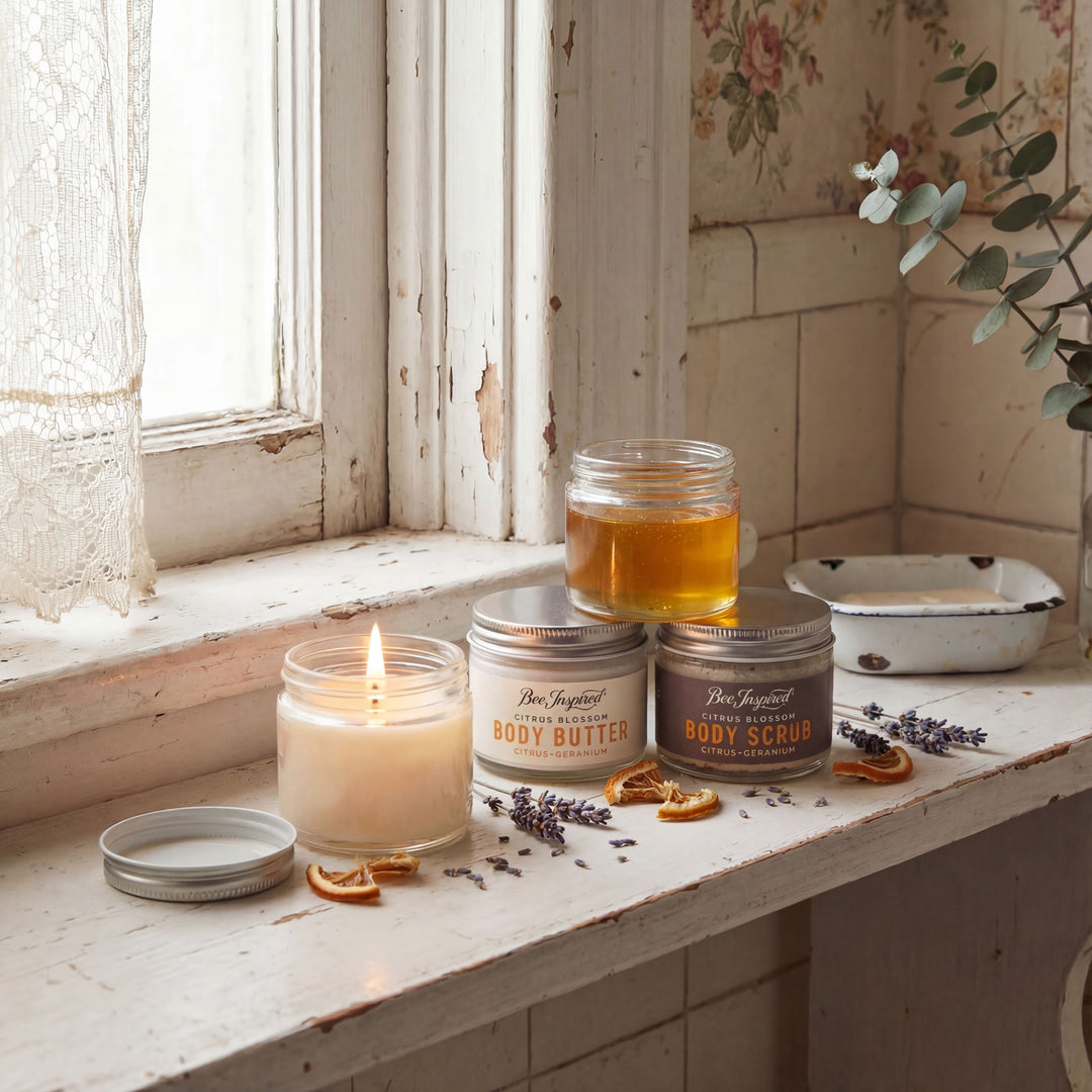 Candle, body butter, and body scrub on a windowsill with a rustic background