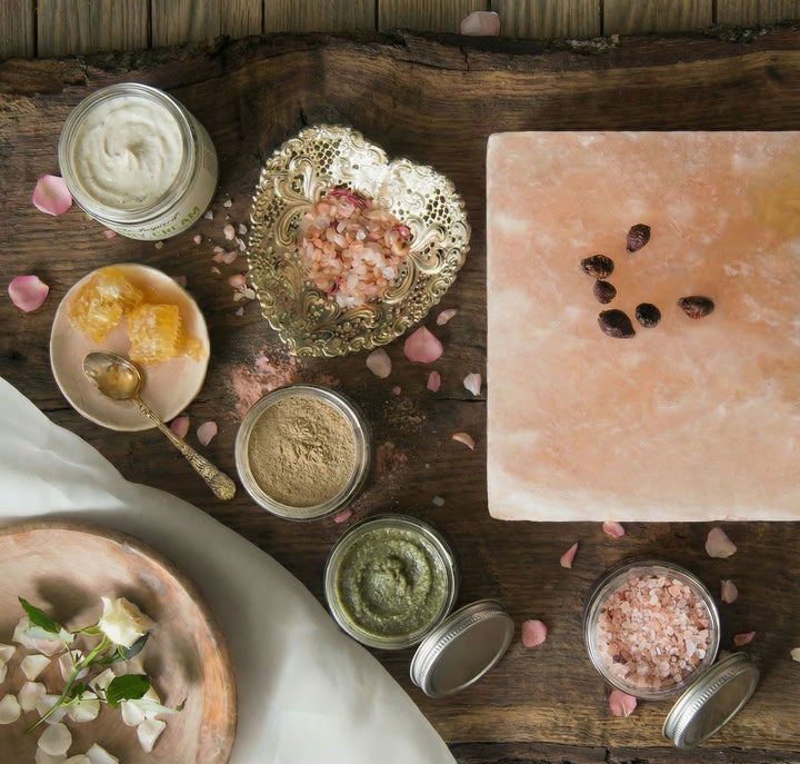Spa or wellness setting with various items on a wooden surface