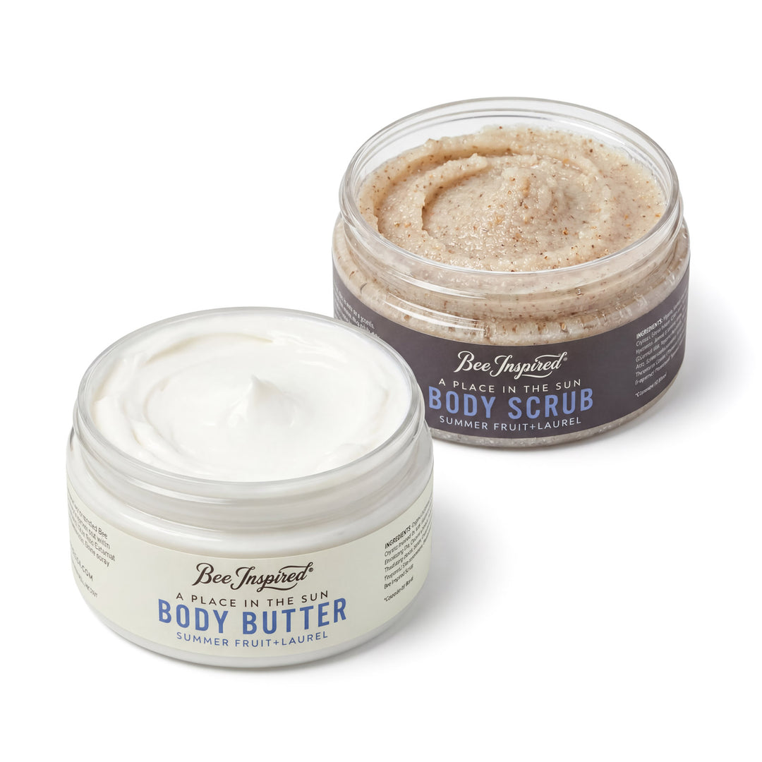 Two containers of 'Bee Inspired' body products on a white background