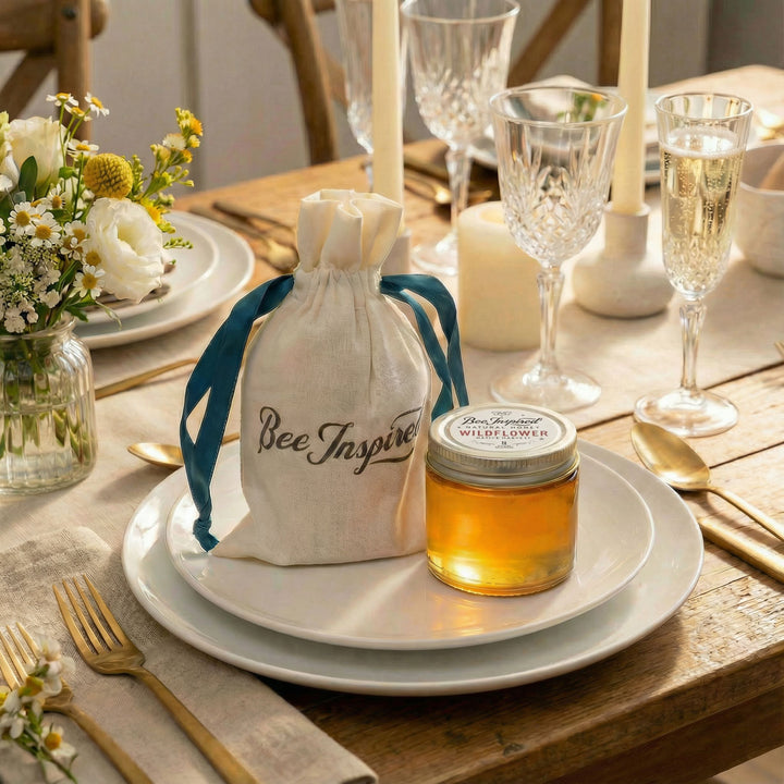 Bee Inspired honey party favor on dinner plate for guests