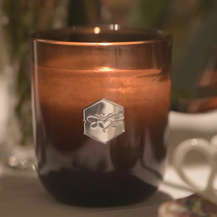 luxe candle  from bee inspired honey retail store in owings mills burning