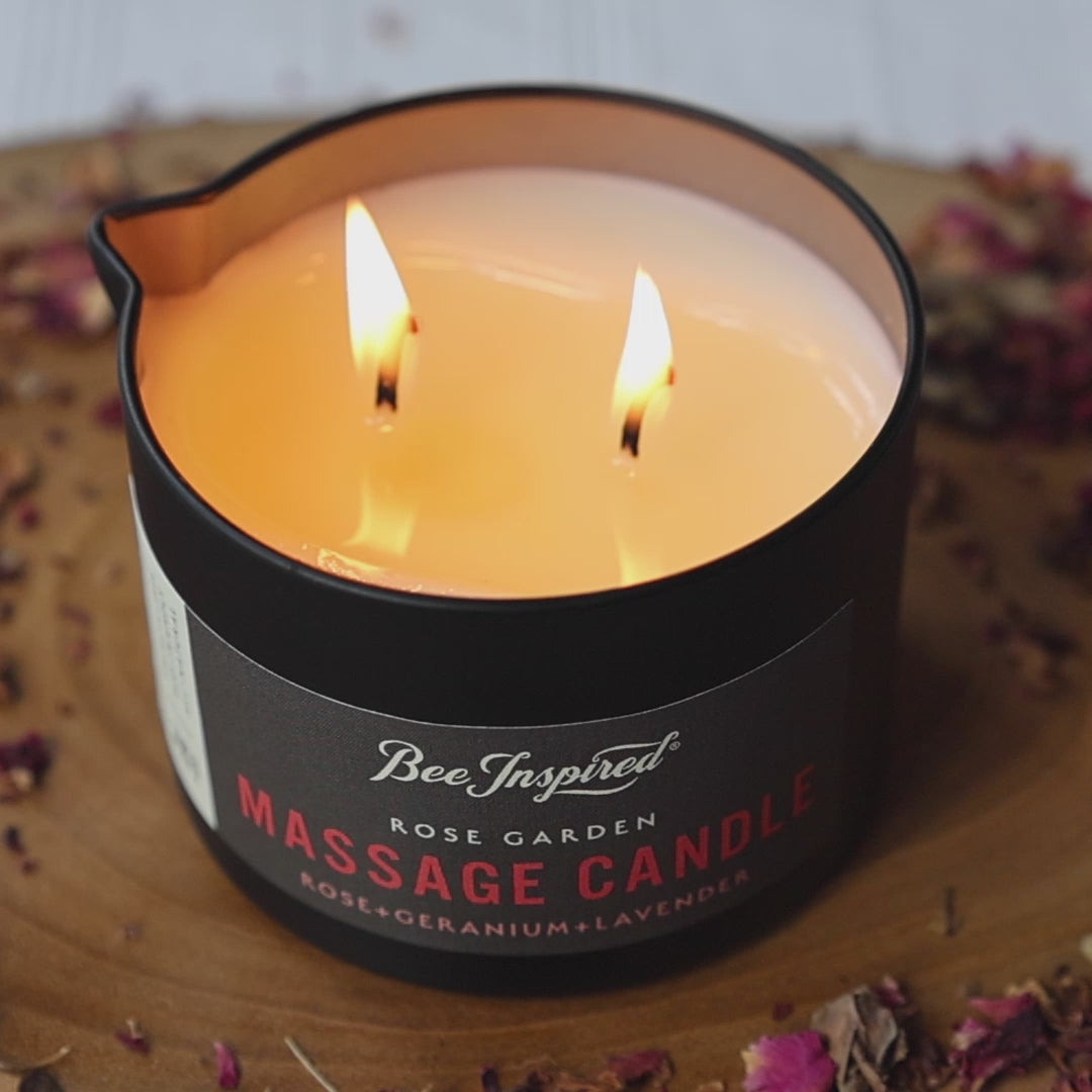 person using the rose garden massage candle from bee inspired honey retail store in owings mills