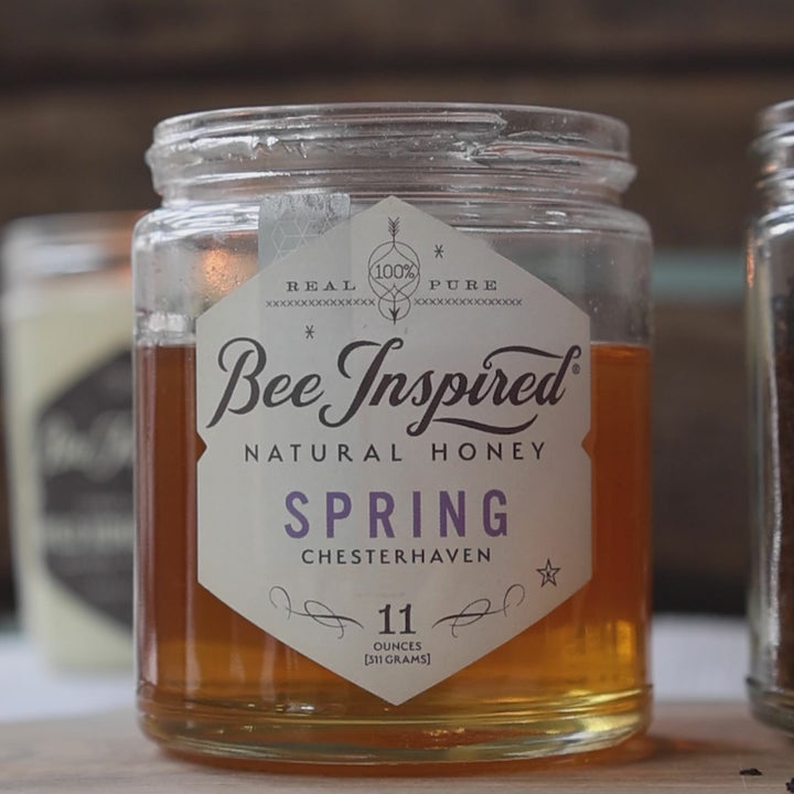 stirring and drizzling spring honey from bee inspired honey retail store in owings mills