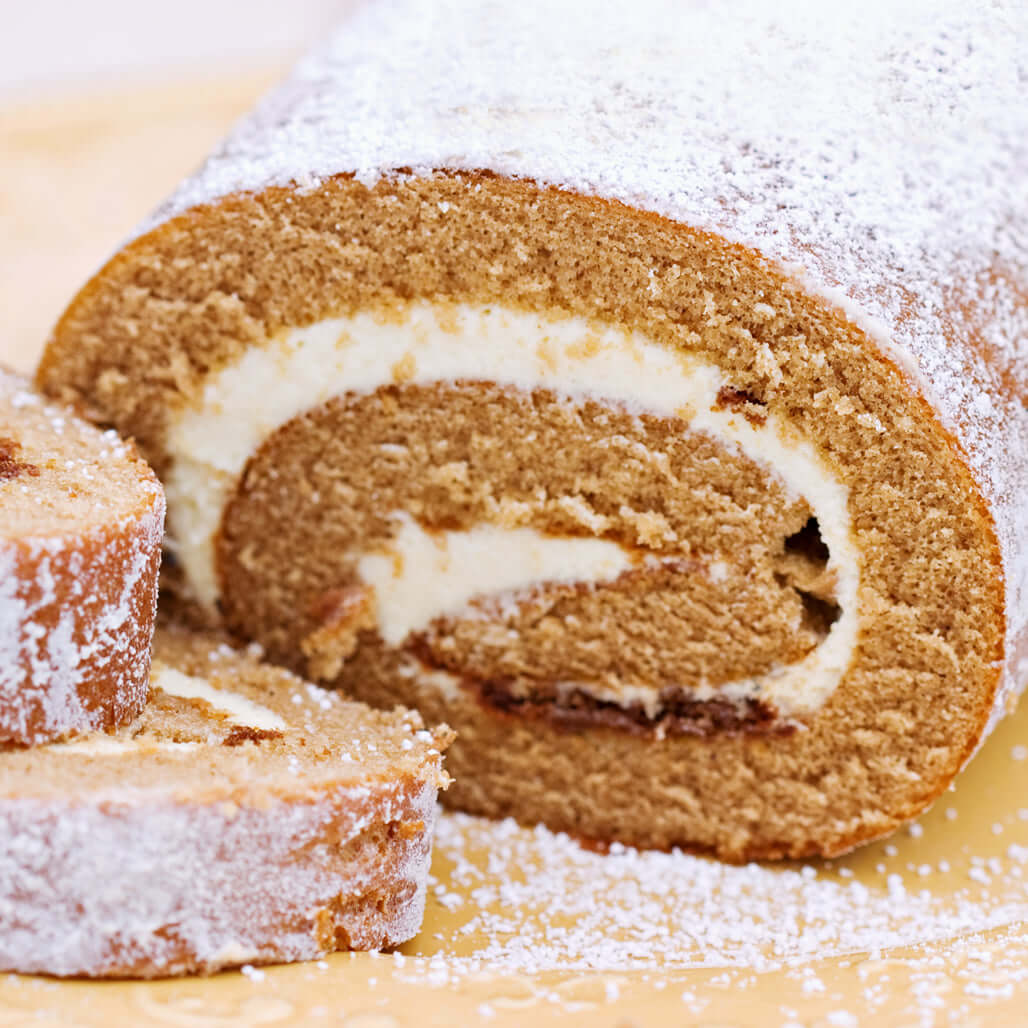 pumpkin roll cut and topped with powdered sugar
